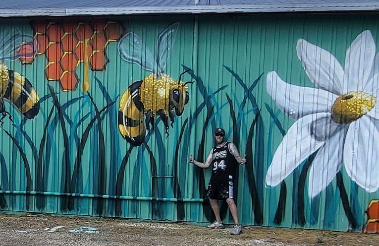 Eyesores to go at entrance to Port, while street artist proves murals work