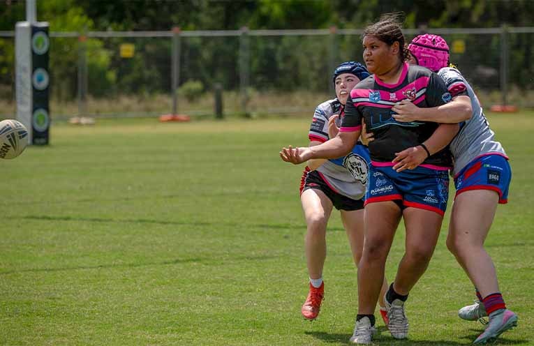 Shakaya Ritchie offloads the ball. Photo: Kim Ambrose/SaltyFoxFotography.