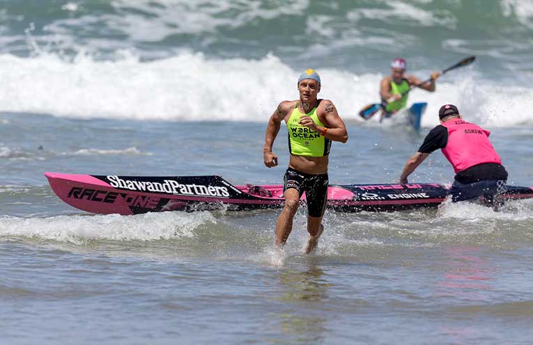Finn Askew strides towards the sand.