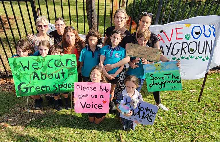 These parents and students of Tacking Point PS are opposed to the preschool - mostly on environmental grounds. Photo: Matt Taylor