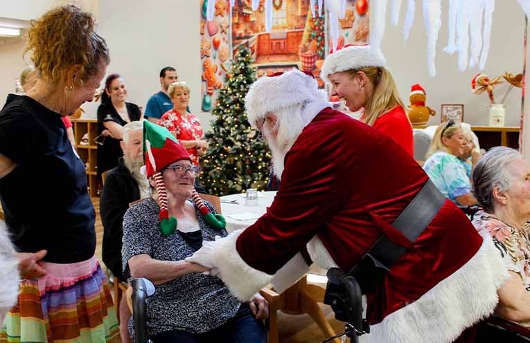 Handshakes and smiles as Santa spreads cheer. Photo: supplied.