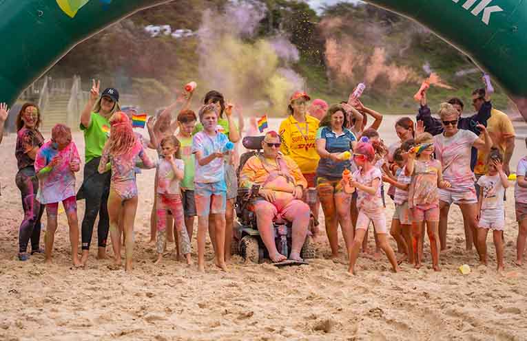 An inclusive ‘colour run’ on the sand of Flynns Beach. Photos: SoftCut Studios-Katie Long.