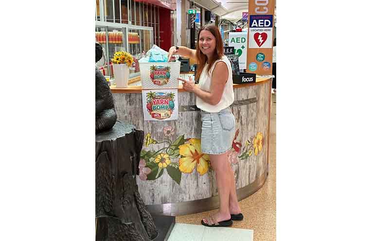 Leah Doeland at the Port Central concierge desk where yarn packs can be collected. Photo: supplied.