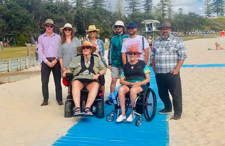 Council representatives, advocates and wheelchair users at Town Beach.