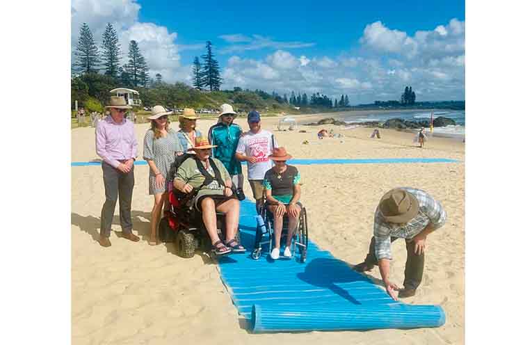 Council representatives, advocates and wheelchair users at Town Beach.