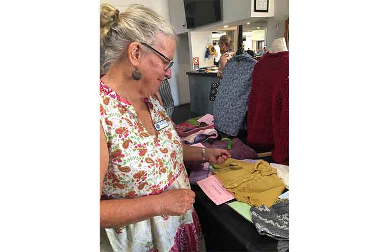Kathryn Jeanes from Wingham Branch admiring some of the handicraft on display.