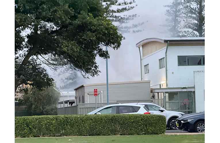 Flames and smoke can be seen from behind the station’s fence. Photos: supplied.