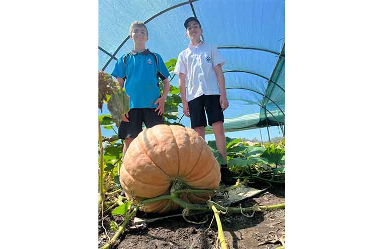 Year 7 Food and Agriculture students from St Joseph’s Regional College with their award winning pumpkin. Photo: supplied.