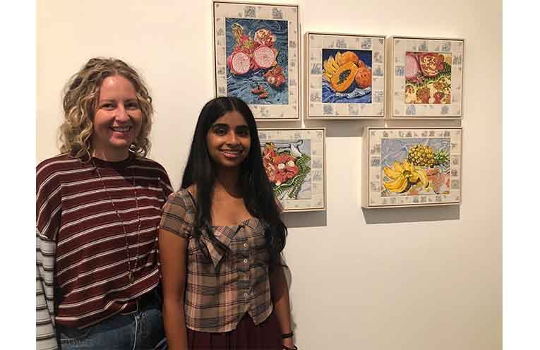 HSC Visual Arts Teacher Lauren Barlow and her former student Meera Nirmalendran from Abbotsleigh College with her artwork ‘Colonial Cargo: The Stolen Harvest’. Photo: Pauline Cain.