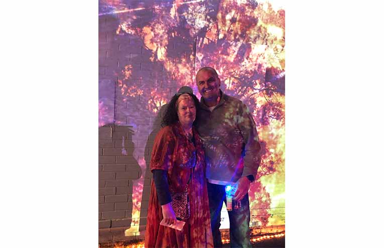 Cherie and Scott Raynor from Sunset Gallery with their projections on Murray Street