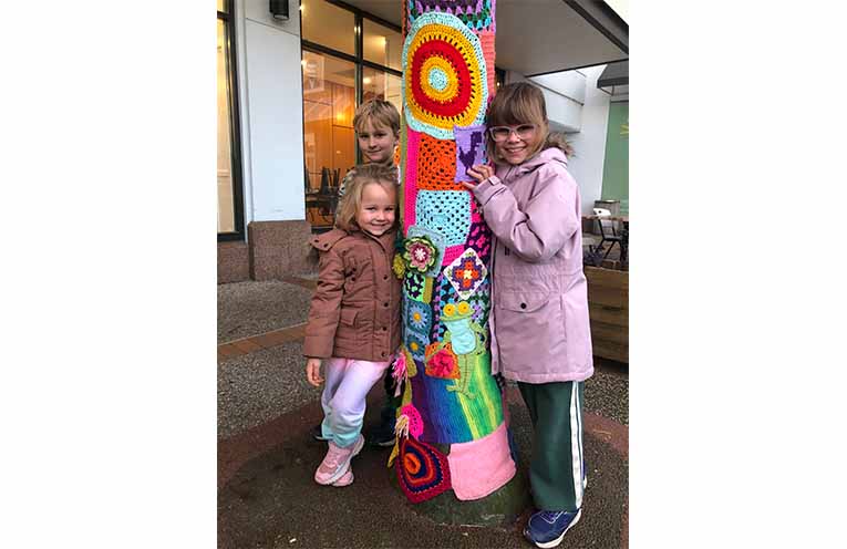 Ezea, Eliza and Eliana from King Creek checking out the yarn bombing of the palm trees in Hay Street.