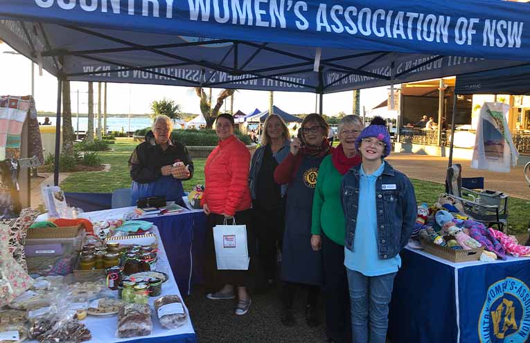 A beautiful afternoon on Town Green just as the sun was setting. From left, CWA President Jill, a happy customer, members Christa, Janis, Lyn, and junior member Rihanna. Photos: Pauline Cain