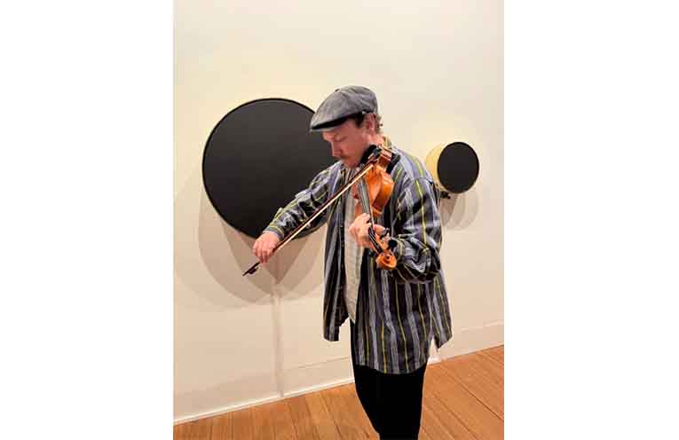 Artist Daniel O’Toole on violin, interacting with his sound installation. Photo: Pauline Cain.
