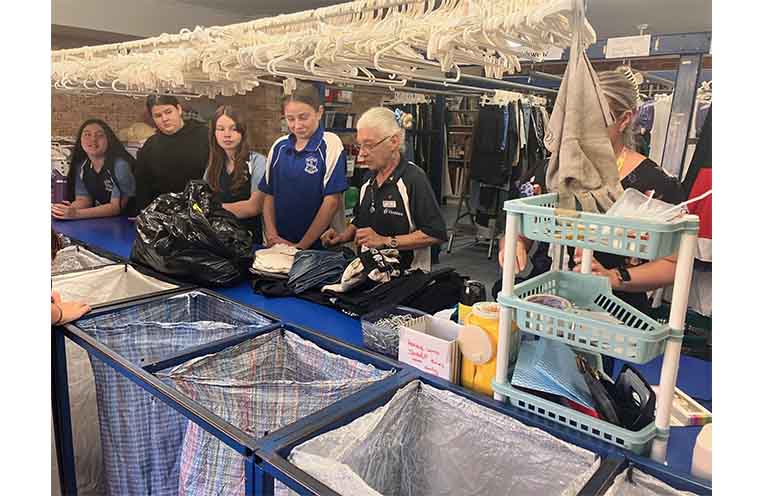 Students help out at Vinnies Op Shop. Photo: Supplied.