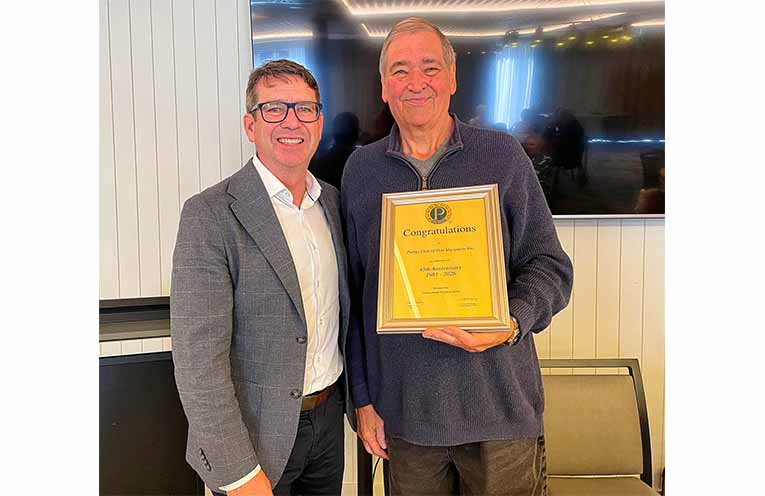 William Quaglio accepts the 45-year certificate from Port Macquarie MP Robert Dwyer. Photo: Supplied.