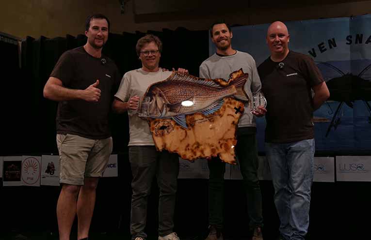 Brice Hayward (left) and Nathan Mann (right) with winners Team The Penguin, Alex Swift and Chris Wilcocks. Photo: Supplied.