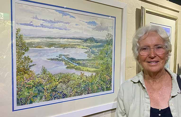 Watercolour painter Anne Falkner at her exhibition in the new Art Hub at Settlement City. Photo: Supplied.