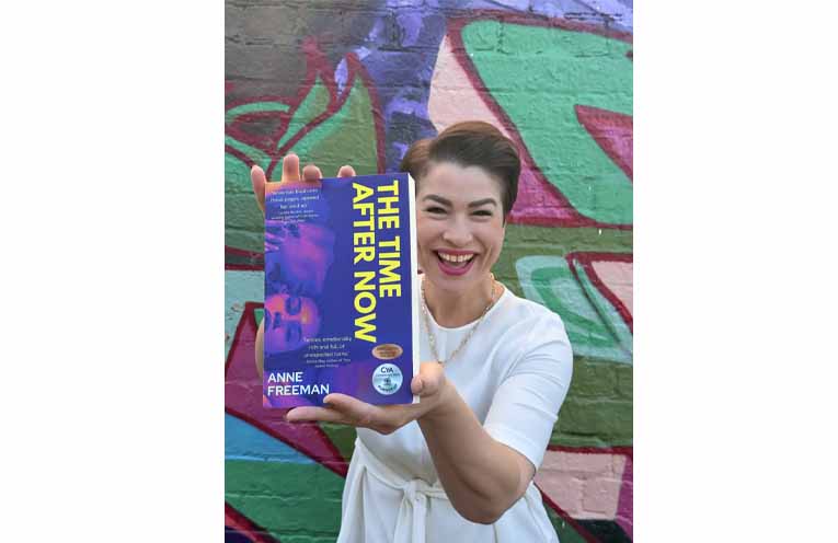 Anne Freeman shows off her brand-new novel.